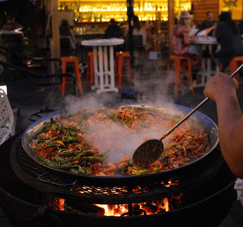 A large pan of stir-fried rice with vegetables